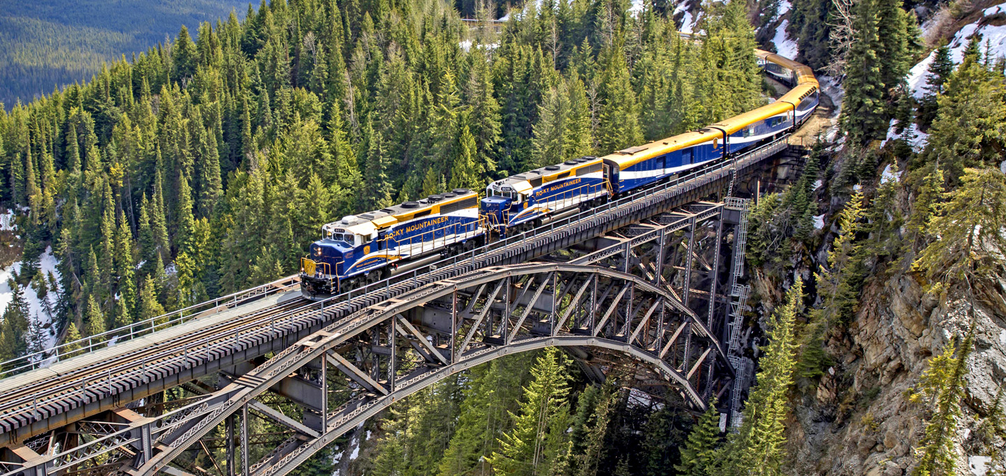 Image of a train traveling through the Canadian Rockies